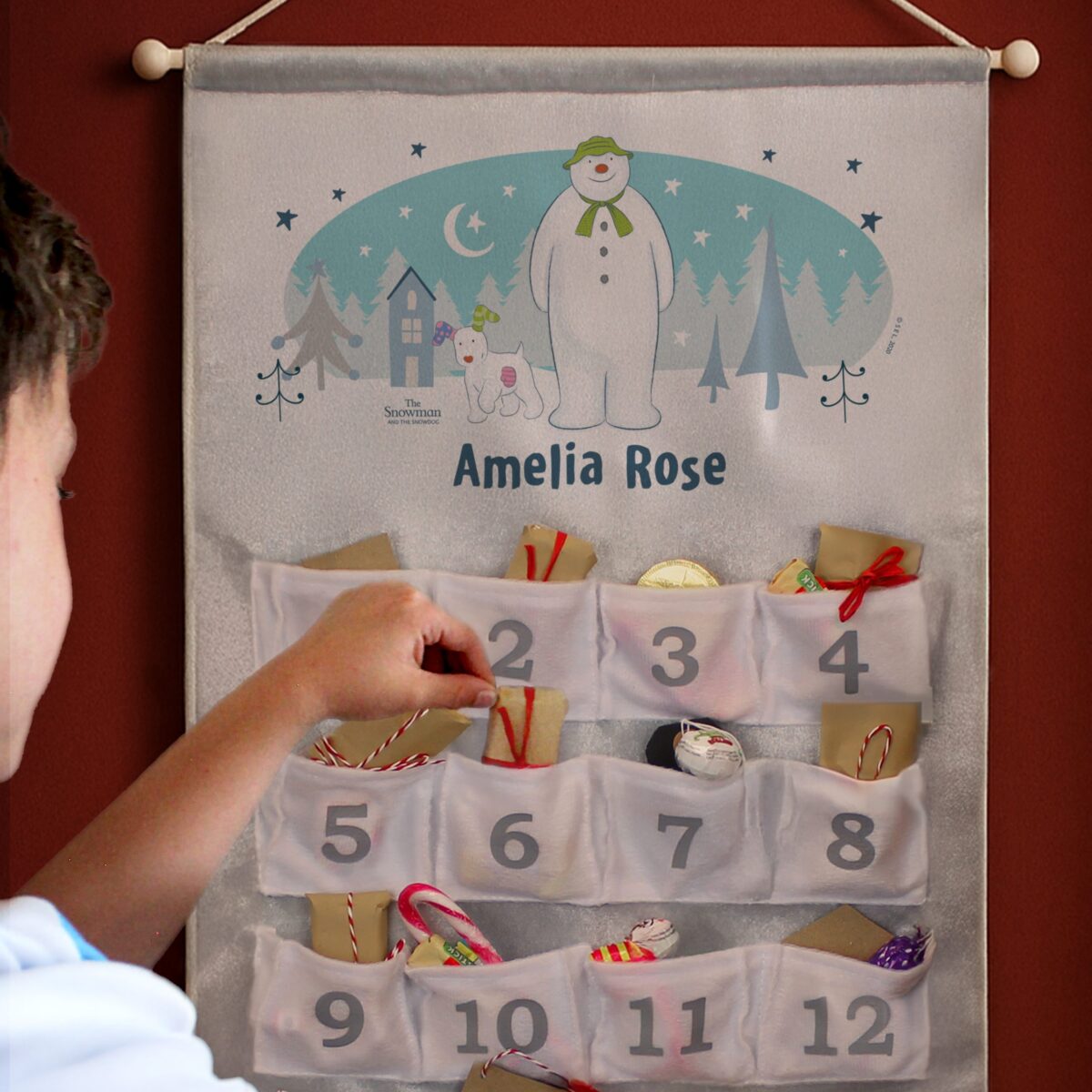 personalised the snowman and the snowdog advent calendar in silver grey