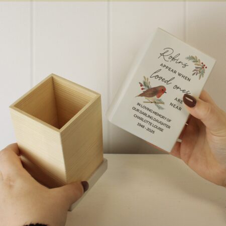 Personalised robins appear small wooden urn