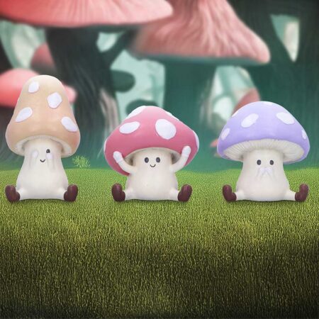 Three wise toadstool figurines see hear speak evil