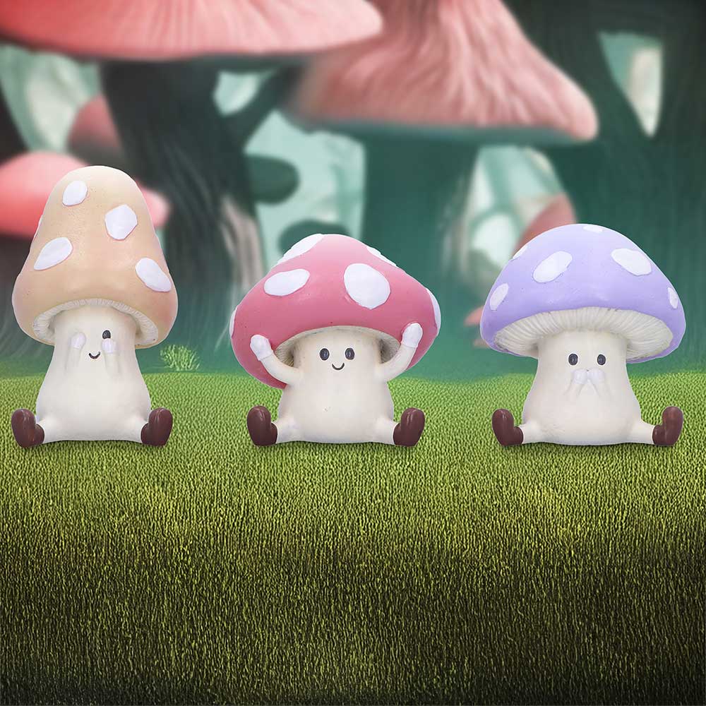 Three wise toadstool figurines see hear speak evil