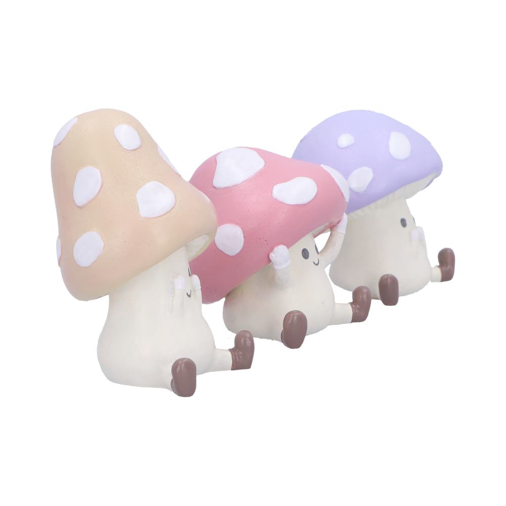 Three wise toadstool figurines see hear speak evil
